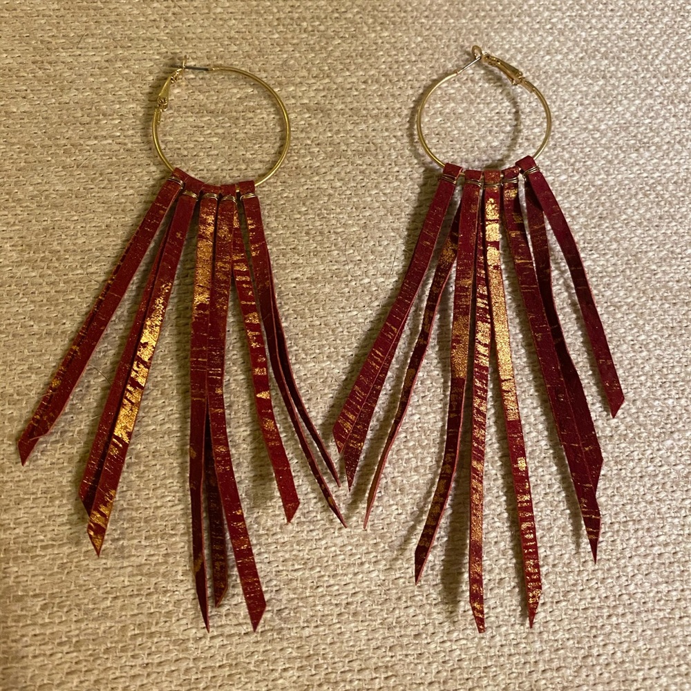 Gold hoops with red tassel